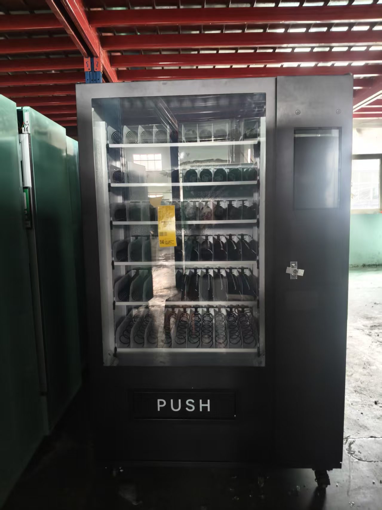 Zhigou Tech upgraded black spiral vending machine with 60 slots before shipment.jpg